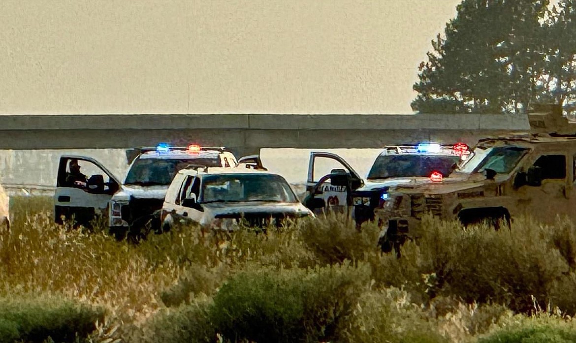 The Grant County Sheriff’s Department surrounds the vehicle of a suspect who allegedly pointed a handgun at three people in George Saturday. The suspect refused to exit the vehicle resulting in pepper balls and flash grenades being discharged. The suspect is in custody and booked at Grant County Jail.