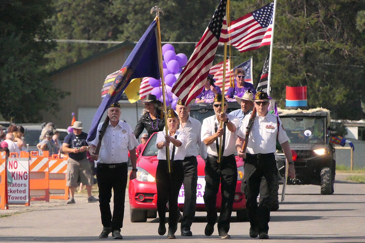 A color guard leads the way at the head of the 2024 Huckleberry Festival parade Saturday morning in Trout Creek.  (Chuck Bandel/VP-MI)