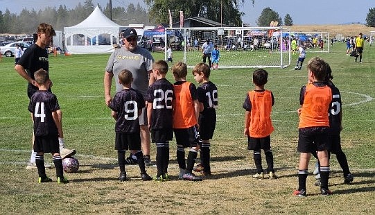 Photo by KELLY LUNDY
Ian McKenna, coach of the Sting Soccer Club 2016 Boys Black team, provides instruction at the 30th annual 2024 Northwest Cup tournament last weekend in Spokane. On Friday afternoon, Aug. 9, the Sting lost 4-2 to the Central Washington Sounders White Arroyo. Sting Black goals were scored by Jackson Martin. Saturday morning, Aug. 10, the Sting fell 11-2 to the Washington East Surf Soccer Club 2016/2017. Sting Black goals were scored by Jackson Martin. That afternoon, the the Sting Black beat the Spokane Sounders Shadow 2016 Basel Valley 6-2. against Spokane Sounders Shadow Basel Valley. Black goals were scored by Eli Hocking, Jackson Martin, Wesson Malmstadt, Oliver Lundy and Peter Ward. On Sunday, the Sting Black beat the Basin Sounders 2016 Lombardini 5-4. Black goals were scored by Kellen McLemore, Jackson Martin and Lincoln Triebwasser.