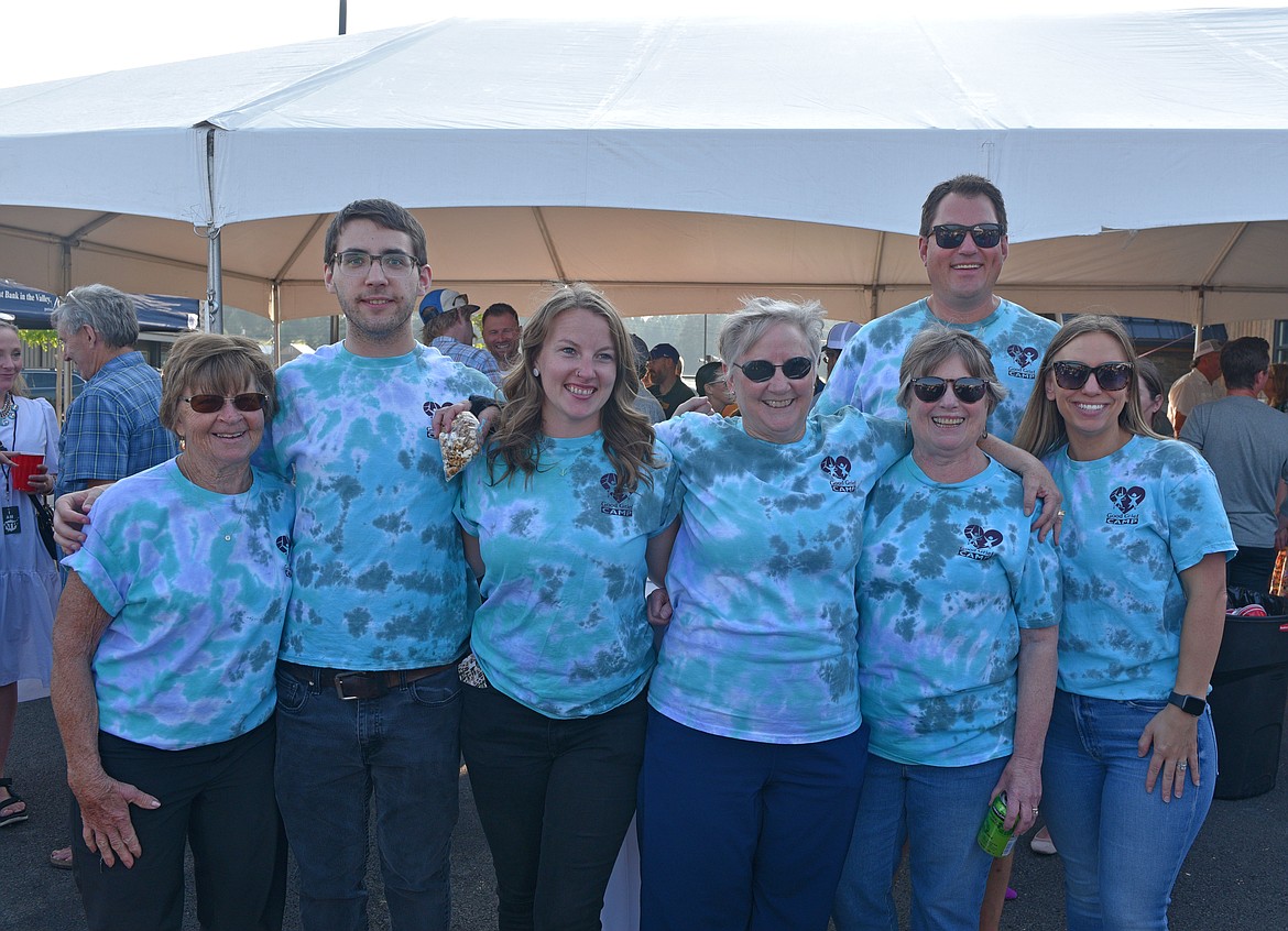 Good Grief Camp team members celebrate the launch of the 10th annual Great Fish Community Challenge at Three Rivers Bank in Whitefish on Thursday. Good Grief Camp is raising funds for grieving children to attend camp in Kalispell. (Kelsey Evans/Whitefish Pilot)