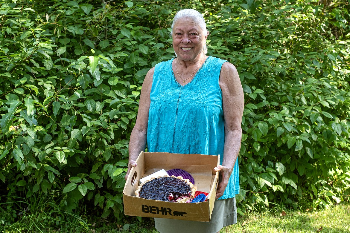 Colleen Daniels of Great Falls poses with her blue ribbon huckleberry pie, a recipe borrowed from friend Val Meeks. (Avery Howe/Bigfork Eagle)