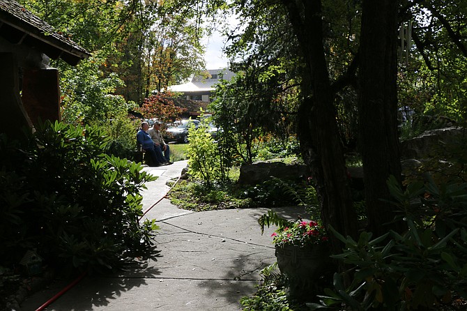 A couple enjoys the peace and tranquility of the Healing Garden. Tucked away long Sand Creek and near Bonner General Health, the garden is a place of spiritual solace, designed as a retreat for both those visiting the hospital and those who work there. It serves, hospital officials said, to give the living a place to reflect and a place to remember those who have passed.