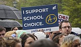 Millions of campaign dollars aimed at tilting school voucher battle are flowing into state races