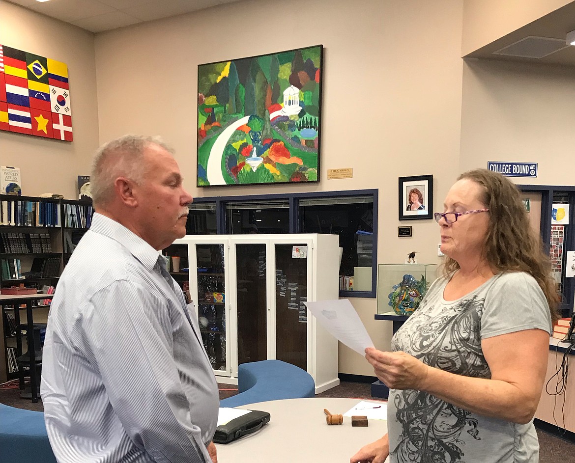 Former Soap Lake Mayor Michelle Agliano swears now-former Soap Lake Mayor Allen DuPuy on August 18, 2022, when DuPuy first became a member of the Soap Lake City Council. Agliano was not reelected and DuPuy became mayor last year. DuPuy has stepped down from the mayor's seat.