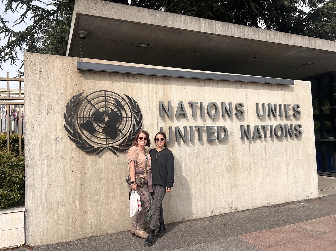 Kaylee Kosareff stands with her mom, her "best friend," in front of the U.N. building in Switzerland.