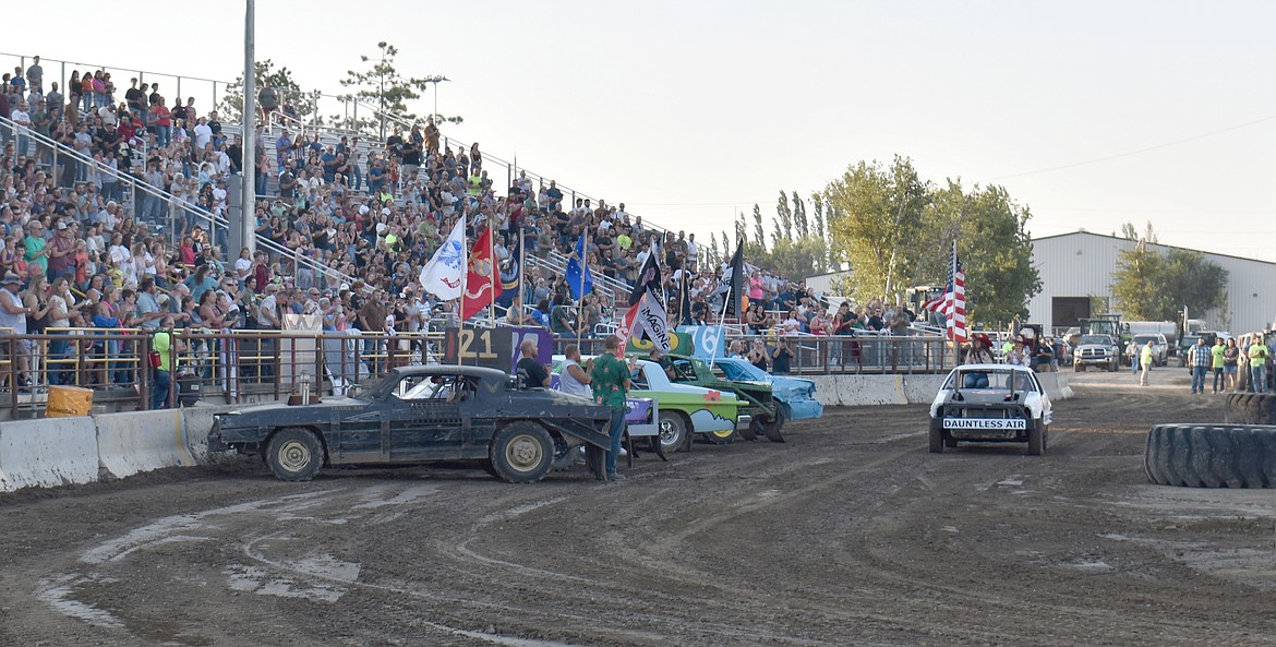 The Agri-Service Demo Derby started Tuesday with a salute to the five branches of the U.S. military, as well as a remembrance of those who served and were never heard from again.