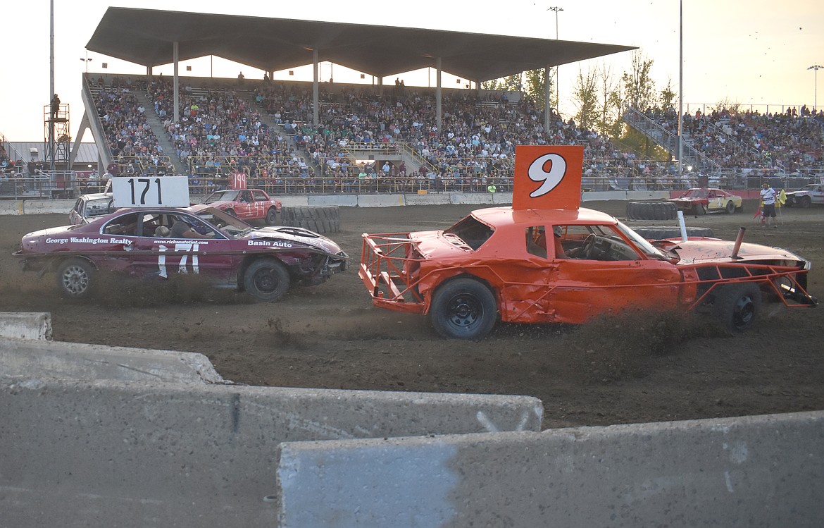 Jake Sligar, No. 11, is in hot pursuit of Winston Roberts, No. 9, at the Agri-Service Demo Derby Tuesday.