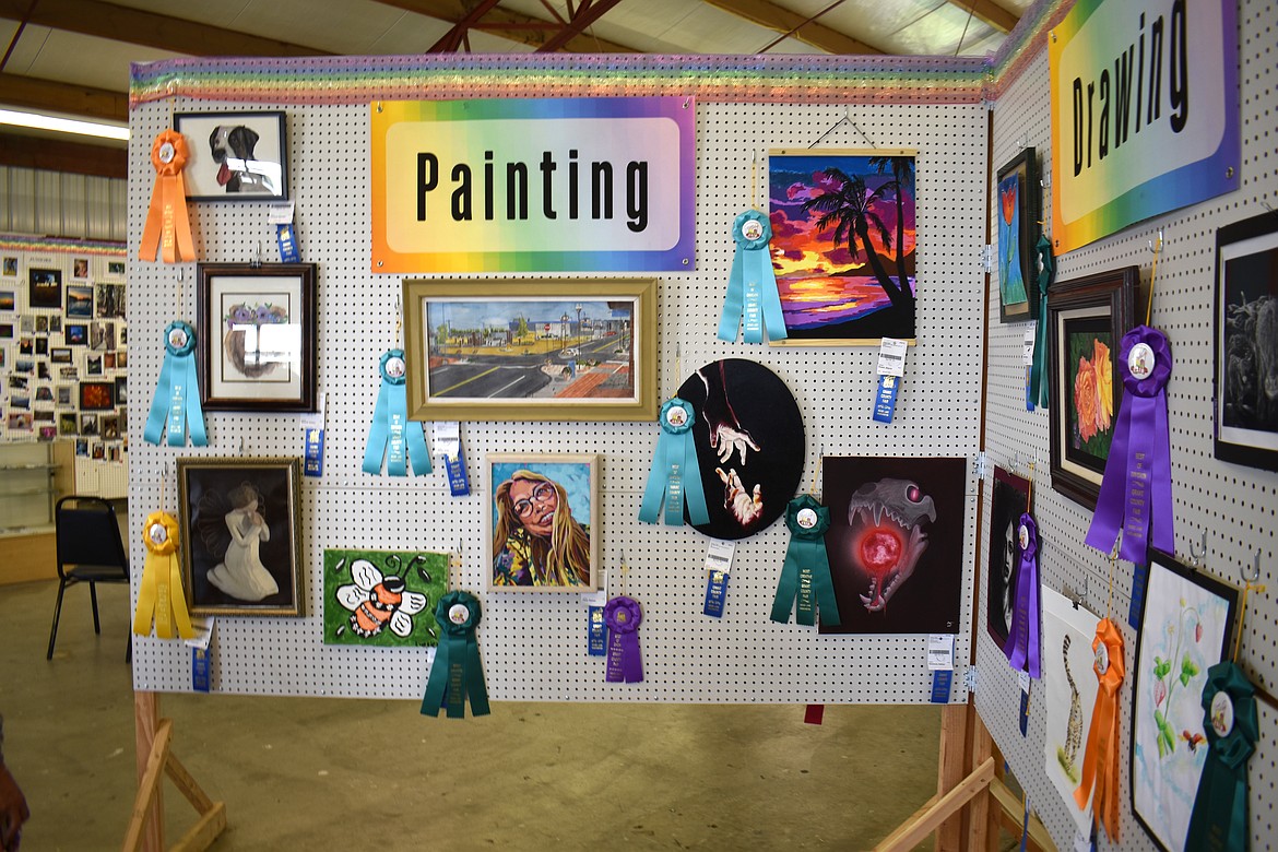 The paintings at the Grant County Fair were varied: acrylics, oils, and watercolors. The most important requirement was that the artist had to like it enough to share it with the whole county.