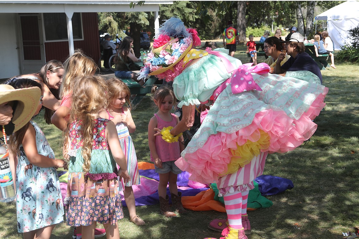 Pippi the Clown is surrounded by a group of young fans at the Bonner County Fairgrounds on Wednesday.