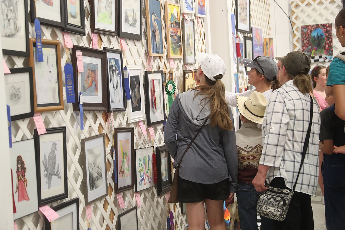 Bonner County residents check out the artwork on display at the Bonner County Fair on Wednesday.