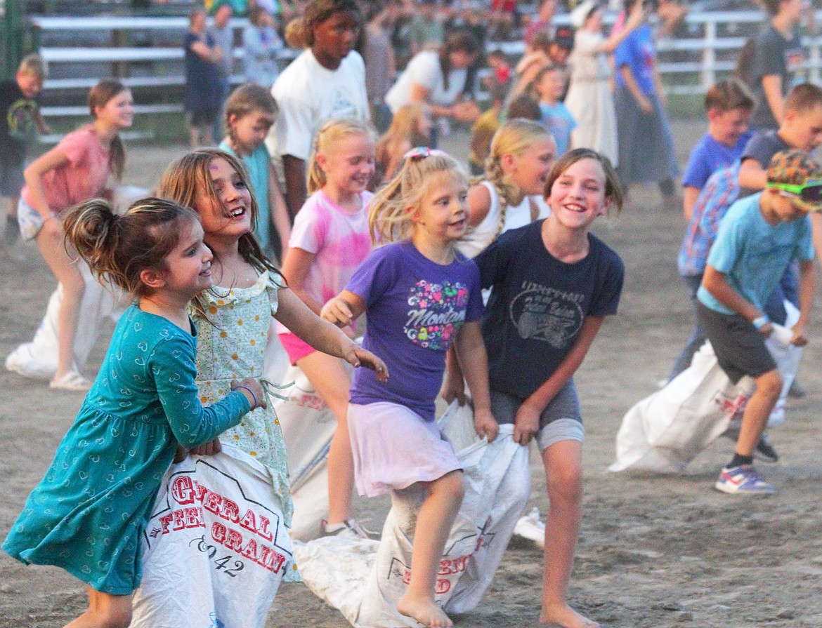 Kids compete in the three-legged race for Family Fun Night at the Boundary County Fair.