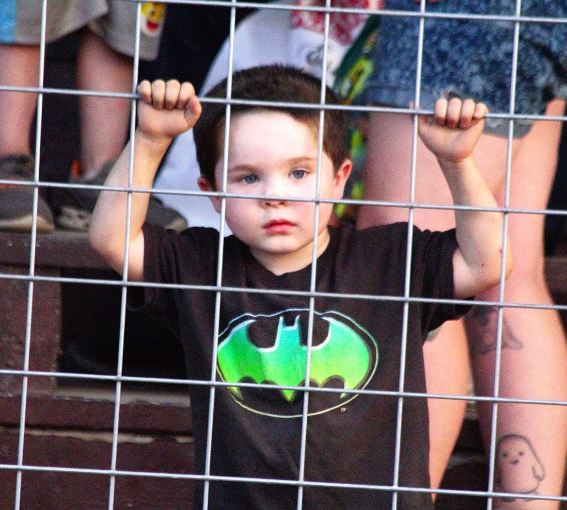 A young boy waits his turn to participate in activities at Family Fun Night.