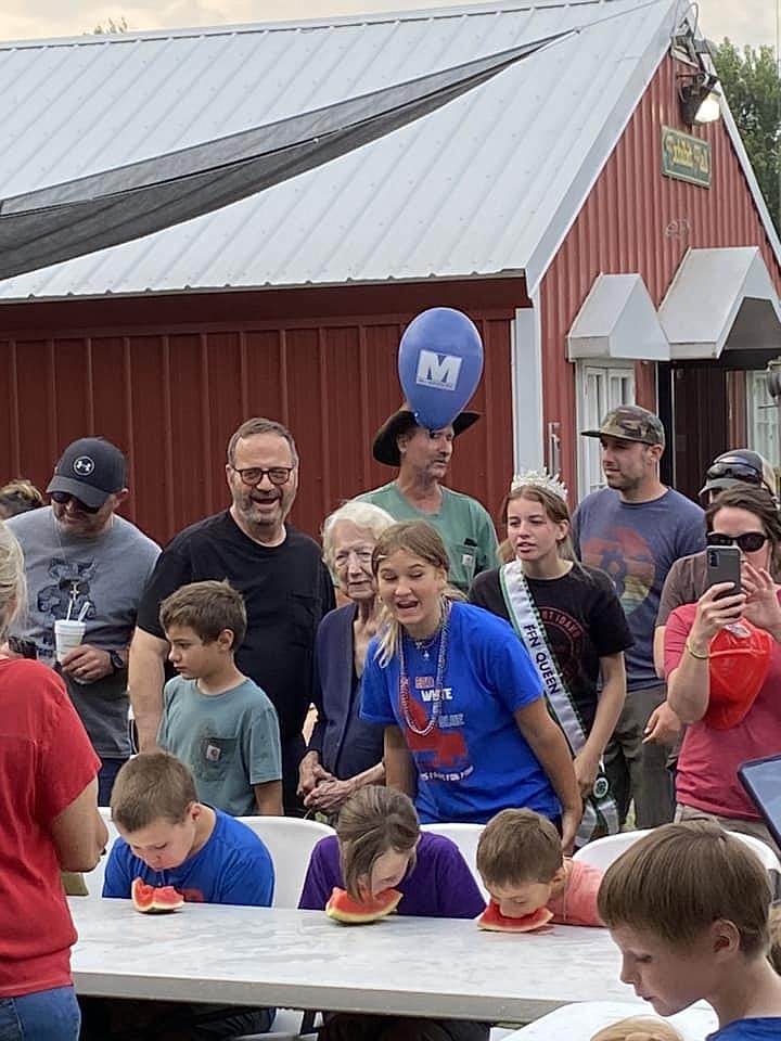 Kids chow down at the pie eating contest. Photo by Nathan Havens-Boone.