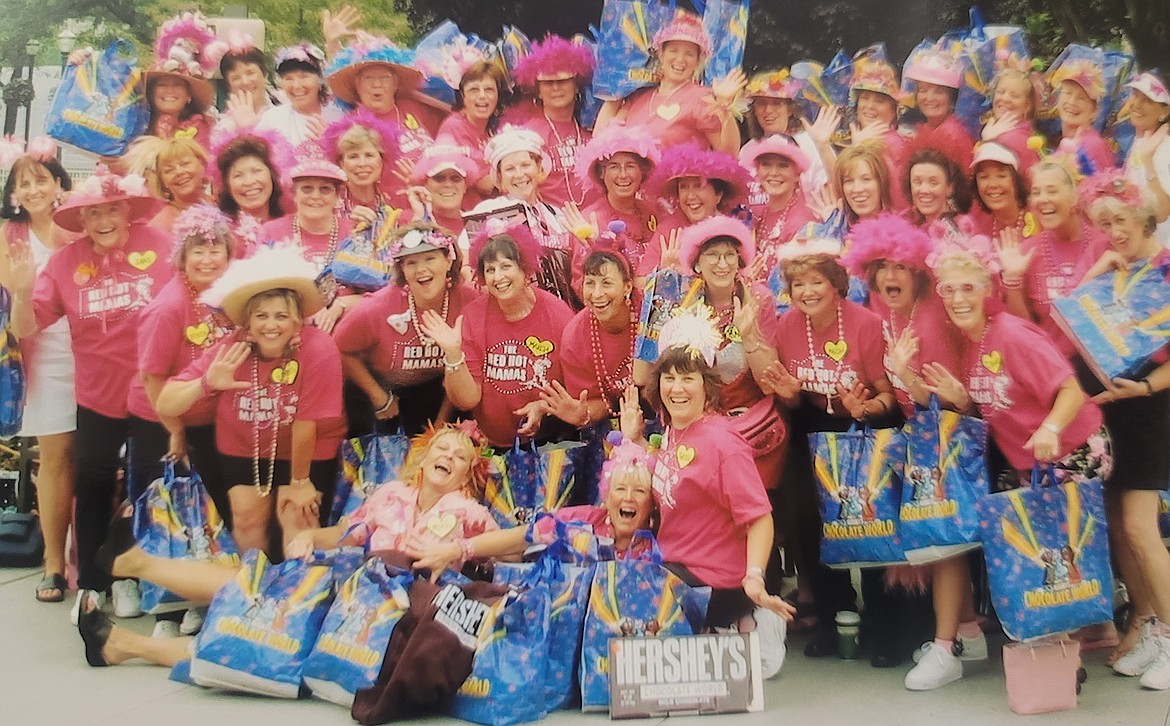 Mikki Stevens, seated front left and beaming a huge smile, is seen with her Red Hot Mamas while on a parade trip in Pennsylvania in 2003.