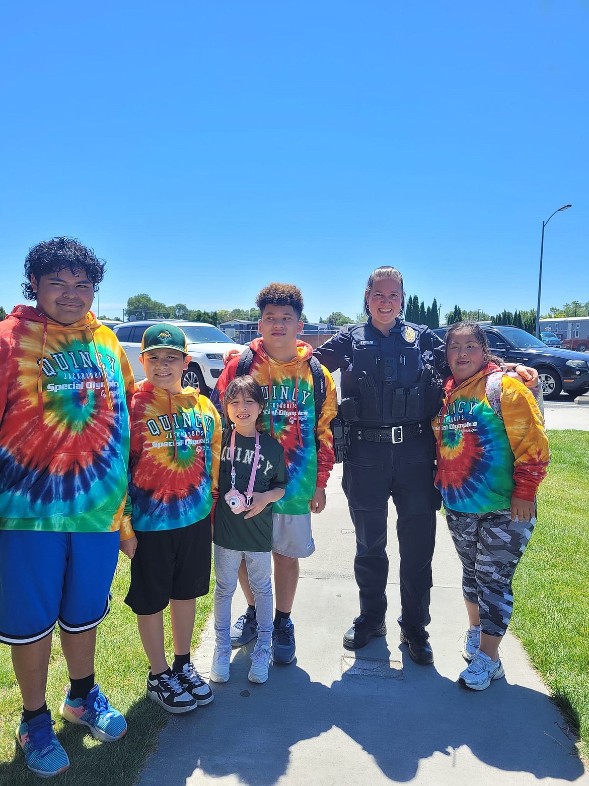 Quincy Special Olympians pose for a photo during their send-off ceremony before traveling to Tacoma for the Spring Games in June. The four athletes received seven medals at the Spring Games.