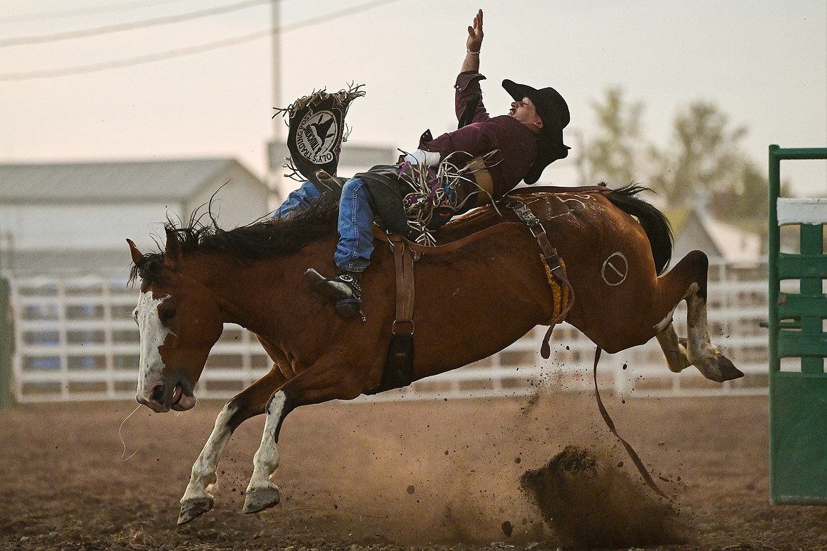 Ty Fast Taypotat, from Nanton, Alberta, Canada, holds onto his horse Crazy Legs during bareback riding at the PRCA Rodeo at the Northwest Montana Fair & Rodeo on Thursday, Aug. 15. (Casey Kreider/Daily Inter Lake)