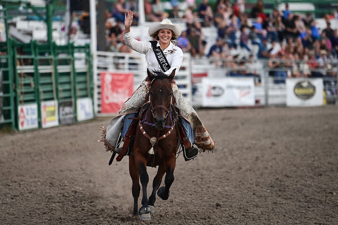 Miss Northwest Montana Rodeo waves to the crowd during the opening ceremonies of the PRCA Rodeo at the Northwest Montana Fair & Rodeo on Thursday, Aug. 15. (Casey Kreider/Daily Inter Lake)