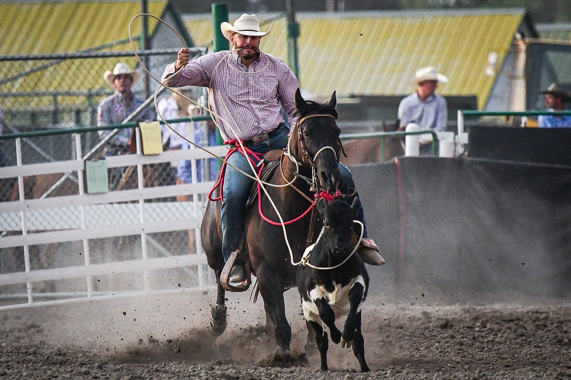 Jesse Medearis, from Belgrade, ropes his calf during tie down roping at the PRCA Rodeo at the Northwest Montana Fair & Rodeo on Thursday, Aug. 15. (Casey Kreider/Daily Inter Lake)