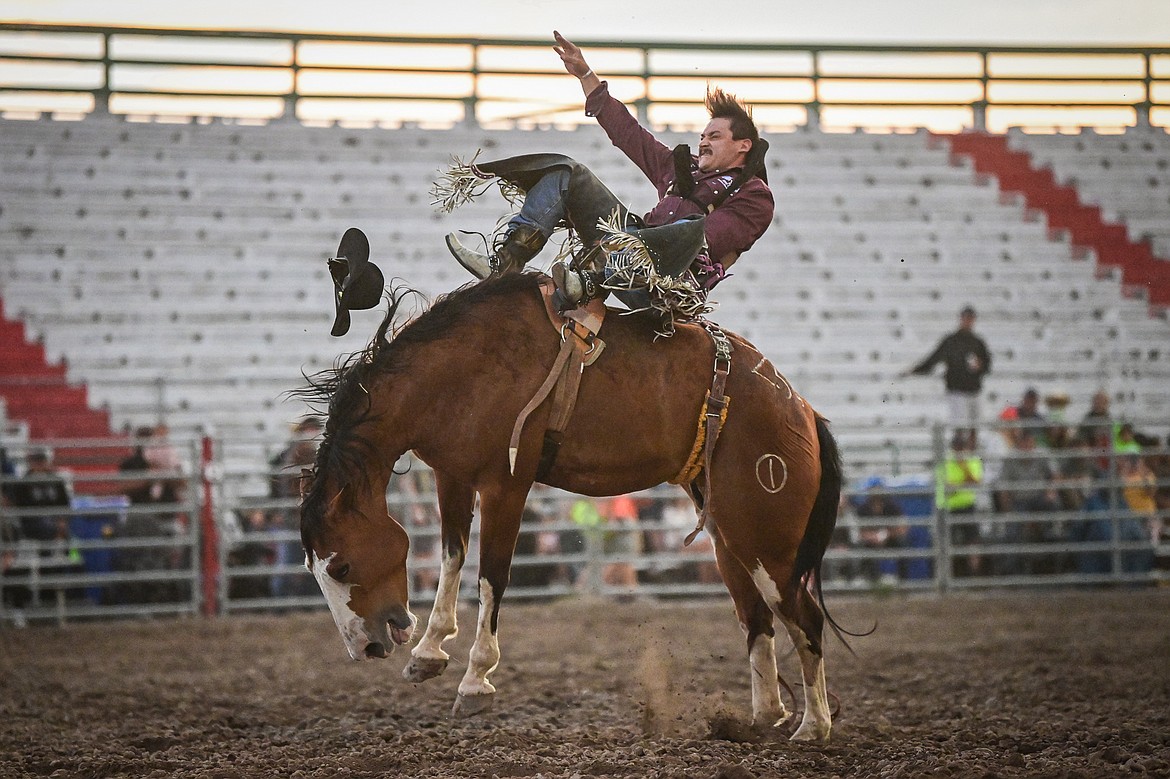 Ty Fast Taypotat, from Nanton, Alberta, Canada, holds onto his horse Crazy Legs during bareback riding at the PRCA Rodeo at the Northwest Montana Fair & Rodeo on Thursday, Aug. 15. (Casey Kreider/Daily Inter Lake)