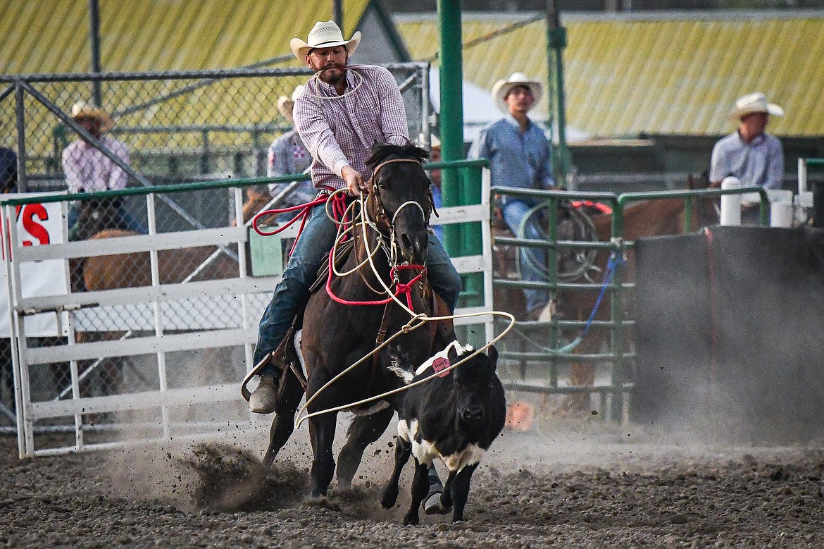 Jesse Medearis, from Belgrade, ropes his calf during tie down roping at the PRCA Rodeo at the Northwest Montana Fair & Rodeo on Thursday, Aug. 15. (Casey Kreider/Daily Inter Lake)