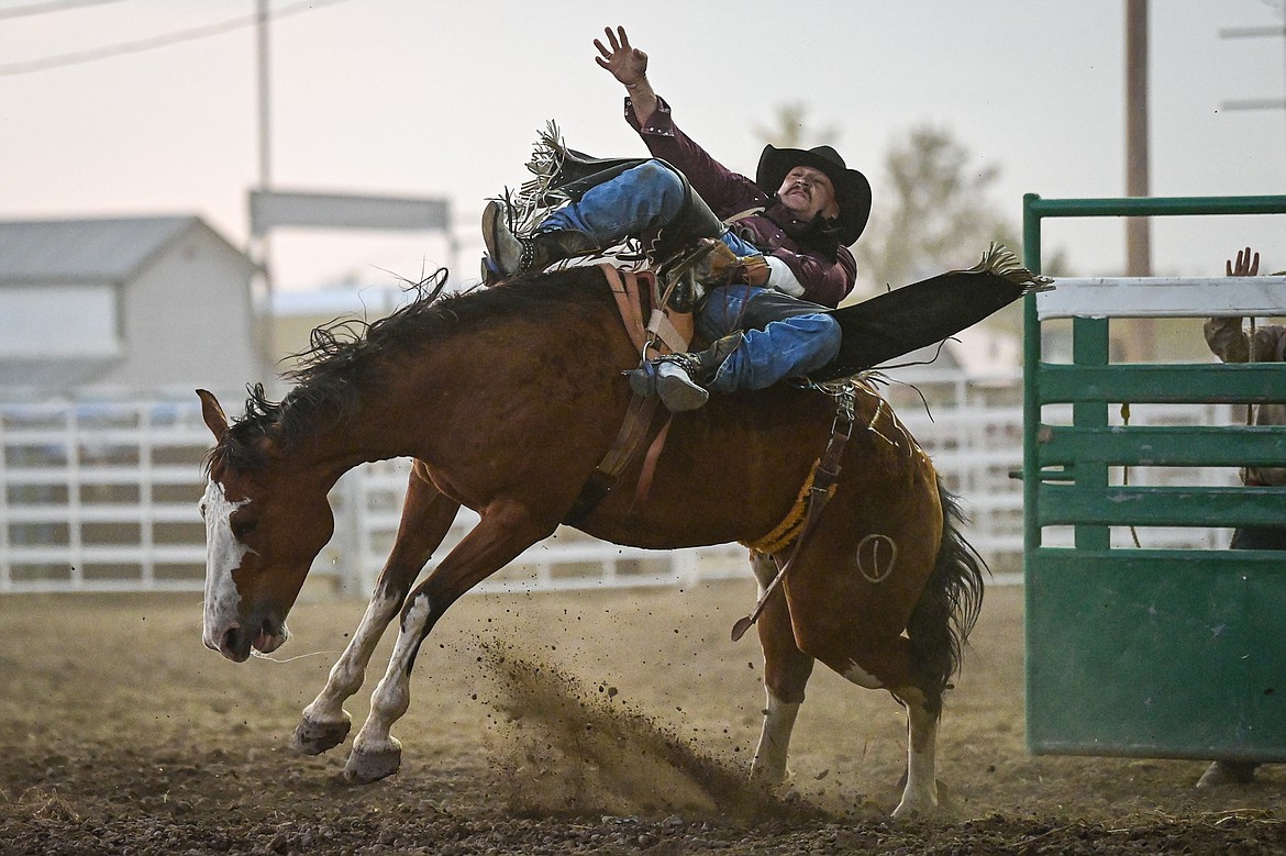 Ty Fast Taypotat, from Nanton, Alberta, Canada, holds onto his horse Crazy Legs during bareback riding at the PRCA Rodeo at the Northwest Montana Fair & Rodeo on Thursday, Aug. 15. (Casey Kreider/Daily Inter Lake)