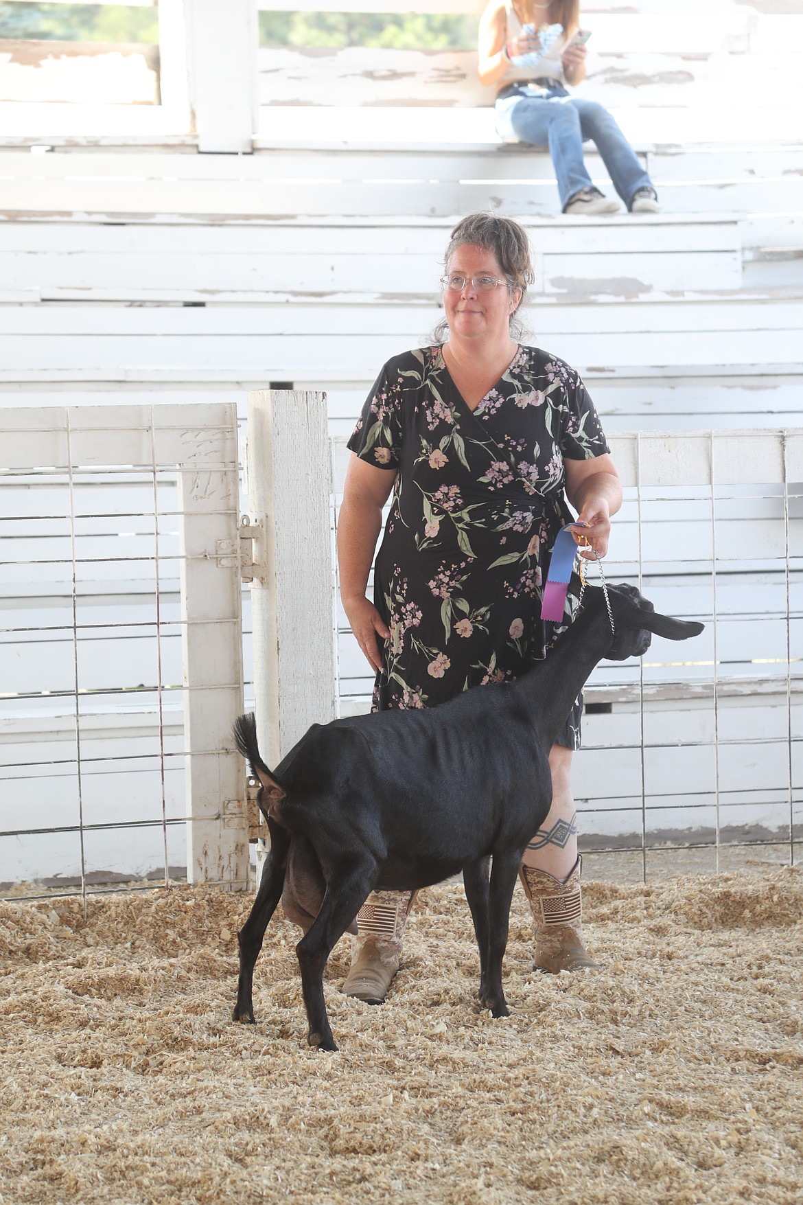 Anita Palmer waits to her the results of a goat competition as she takes part in the Bonner County Fair on Thursday.