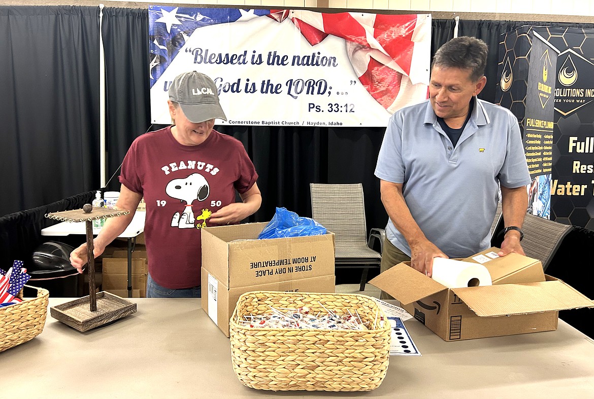 Pastor Ruben Garcia and his wife Sharon set up their booth on Thursday for the North Idaho State Fair.