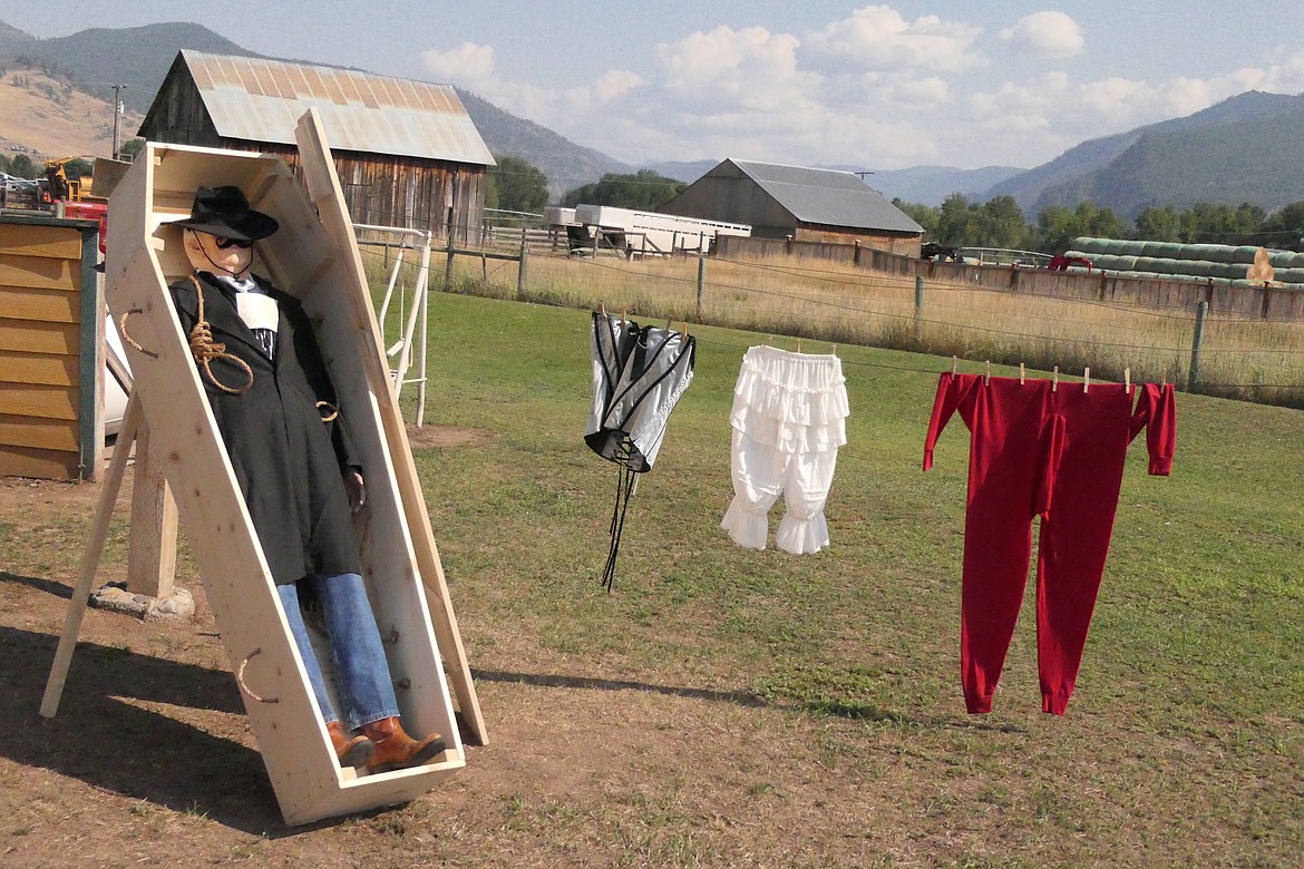 A desperado in his final pose in a coffin outside the backyard saloon built by Dan and Pat Johnson. (Chuck Bandel/VP-MI)