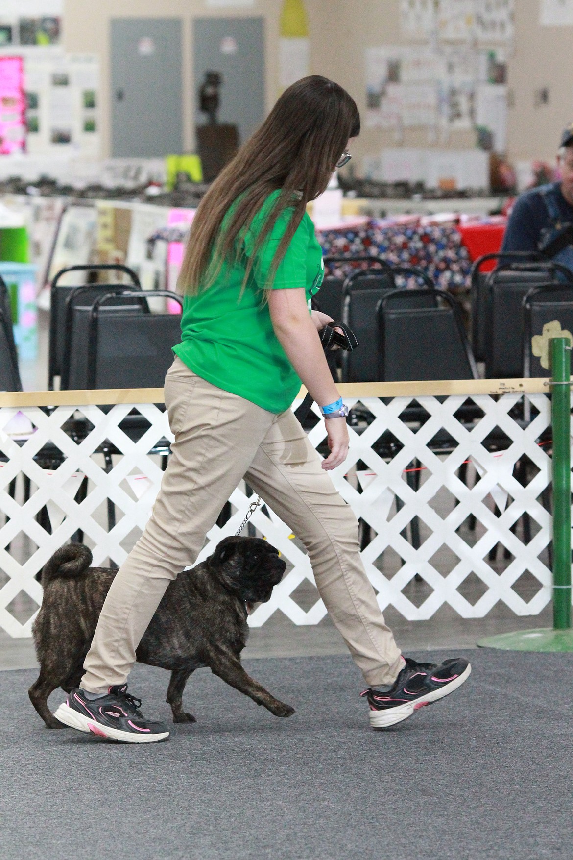 River Spees struts her pug, Propane through the pin during the obedience competition. Propane is three years old.