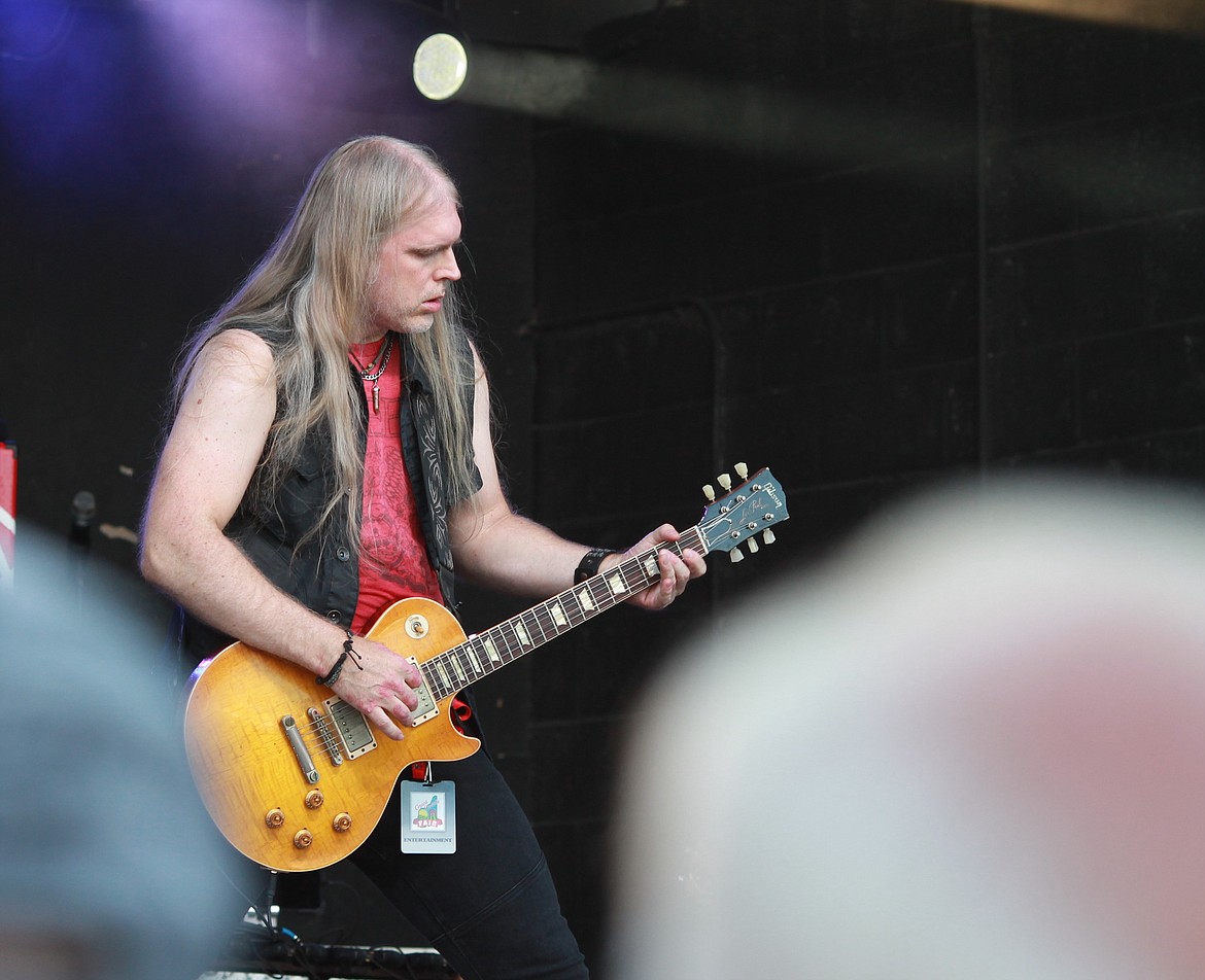 Dylan Cormier, the guitarist for Crazy Train, an Ozzy Osbourne tribute band, shreds his guitar on stage at the Grant County Fair on Wednesday. According to his bio, he has played in venues across New England since he was 13.