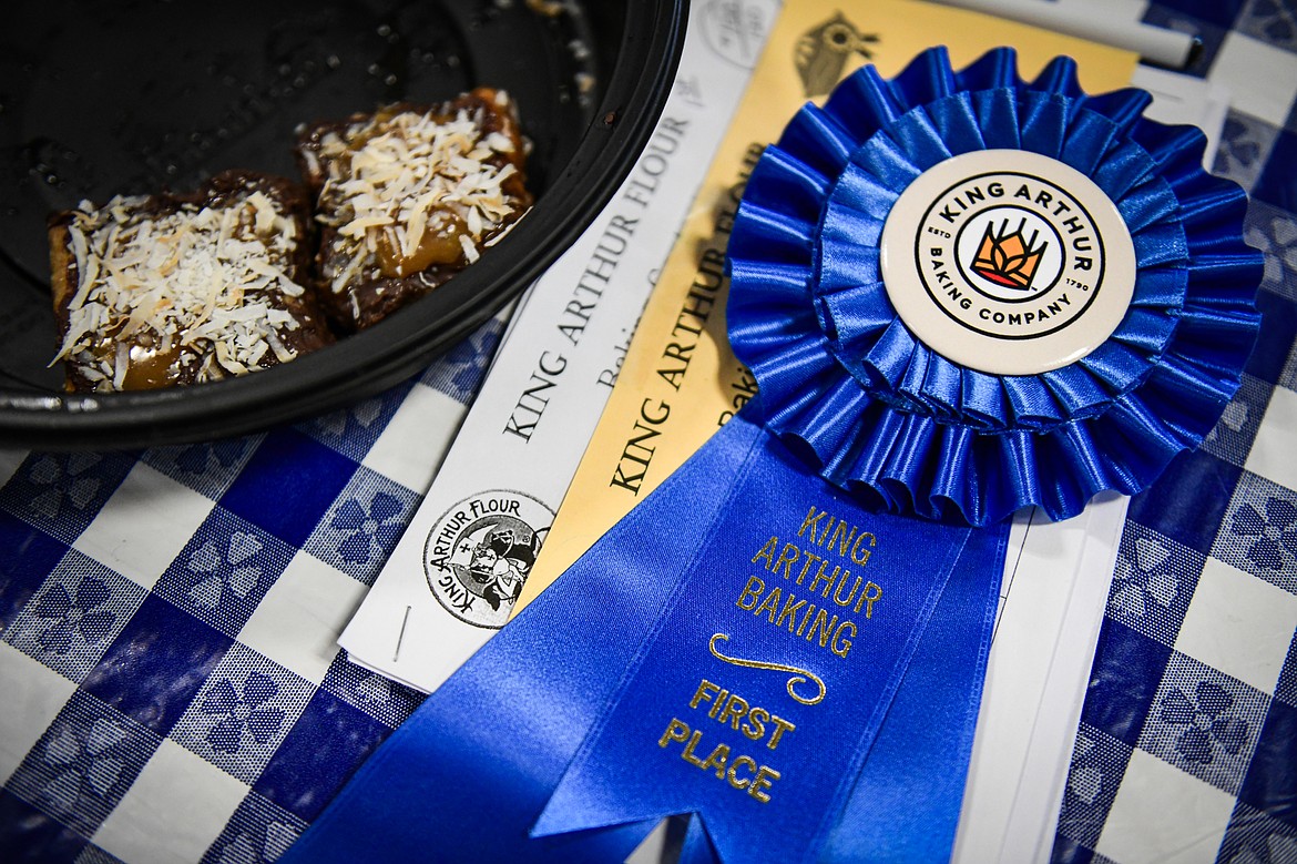 Melissa Friess' first-place ribbon next to the remainder of her Grand Prize Coconut Caramel Bars in the King Arthur Baking Competition at the Northwest Montana Fair & Rodeo on Friday, Aug. 16. (Casey Kreider/Daily Inter Lake)