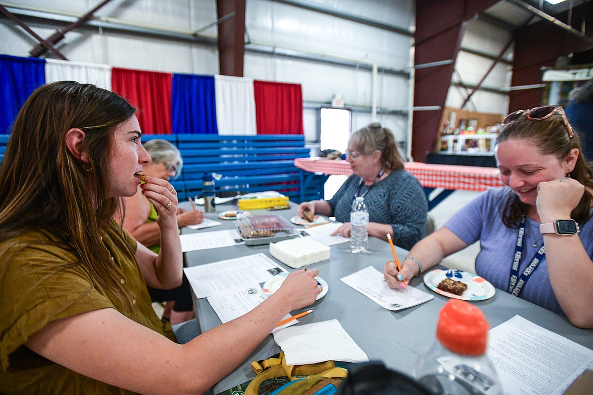 Judges sample all the entries in the King Arthur Baking Competition at the Northwest Montana Fair & Rodeo on Friday, Aug. 16. (Casey Kreider/Daily Inter Lake)