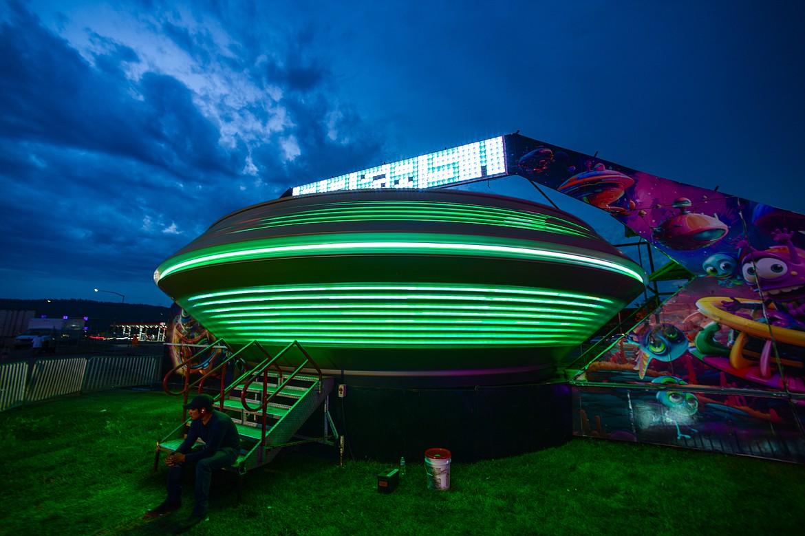 The Area 51 ride glows at dusk at the carnival at the Northwest Montana Fair & Rodeo on Thursday, Aug. 15. (Casey Kreider/Daily Inter Lake)