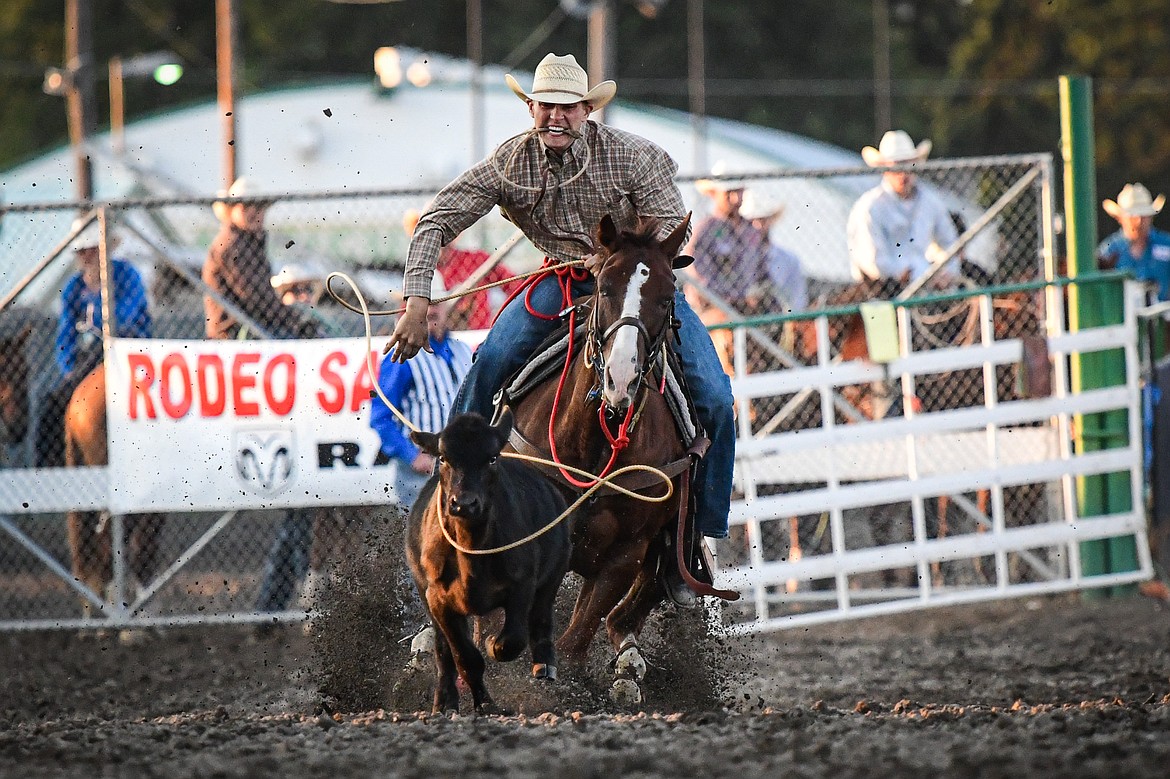 Cash Edward Hooper ropes s calf during tie down roping at the PRCA Rodeo during the Northwest Montana Fair & Rodeo on Friday, Aug. 16. (Casey Kreider/Daily Inter Lake)