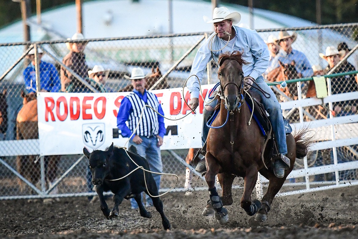 Shane Smith ropes his calf during tie down roping at the PRCA Rodeo during the Northwest Montana Fair & Rodeo on Friday, Aug. 16. (Casey Kreider/Daily Inter Lake)