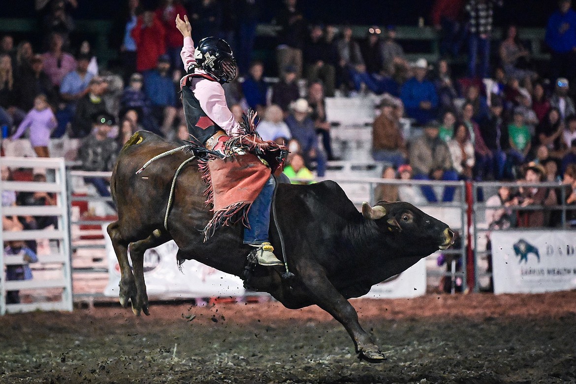 Korbin Baldwin, from Whitefish, competes in bull riding at the PRCA Rodeo during the Northwest Montana Fair & Rodeo on Friday, Aug. 16. (Casey Kreider/Daily Inter Lake)