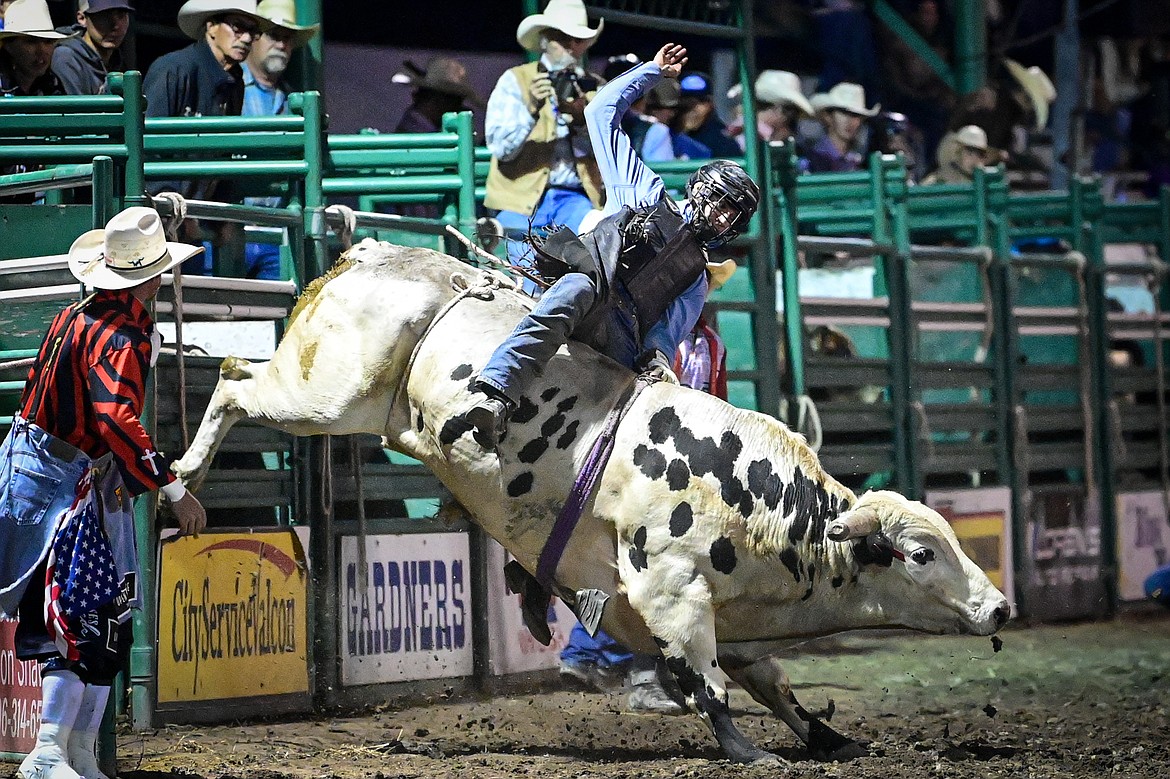 Bo Vocu, from Ashland, competes in bull riding at the PRCA Rodeo during the Northwest Montana Fair & Rodeo on Friday, Aug. 16. (Casey Kreider/Daily Inter Lake)