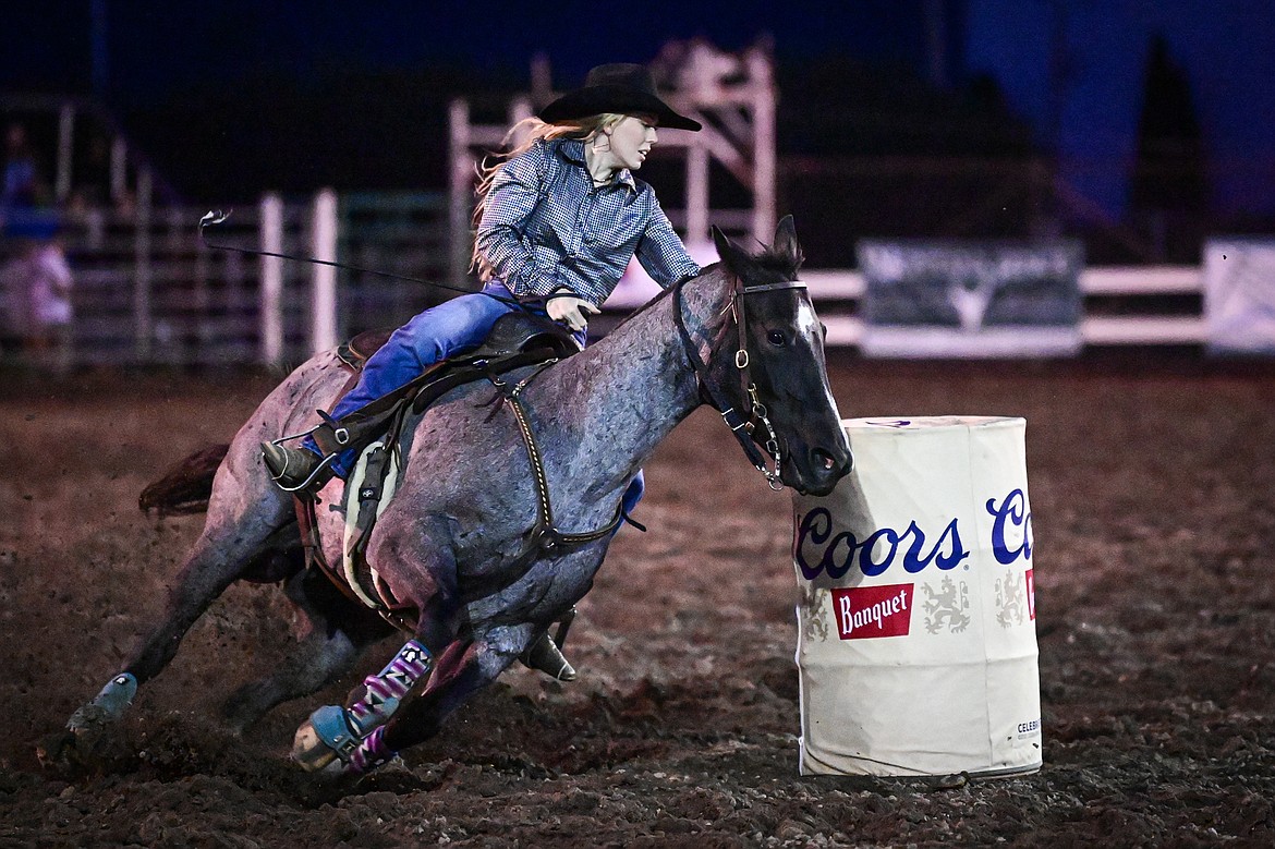 Brittney Cox, from Chinook, competes in barrel racing at the PRCA Rodeo during the Northwest Montana Fair & Rodeo on Friday, Aug. 16. (Casey Kreider/Daily Inter Lake)