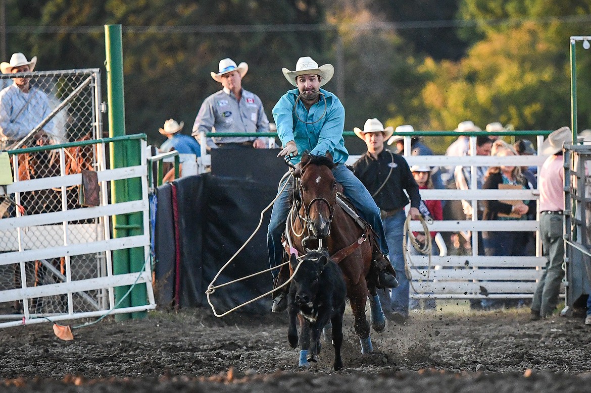 Ben Robinson ropes a calf during tie down roping at the PRCA Rodeo during the Northwest Montana Fair & Rodeo on Friday, Aug. 16. (Casey Kreider/Daily Inter Lake)