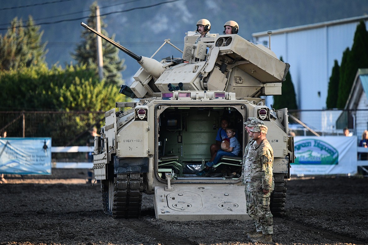 Military personnel ride into the arena in an M2A3 Bradley Fighting Vehicle at the PRCA Rodeo during the Northwest Montana Fair & Rodeo on Friday, Aug. 16. (Casey Kreider/Daily Inter Lake)