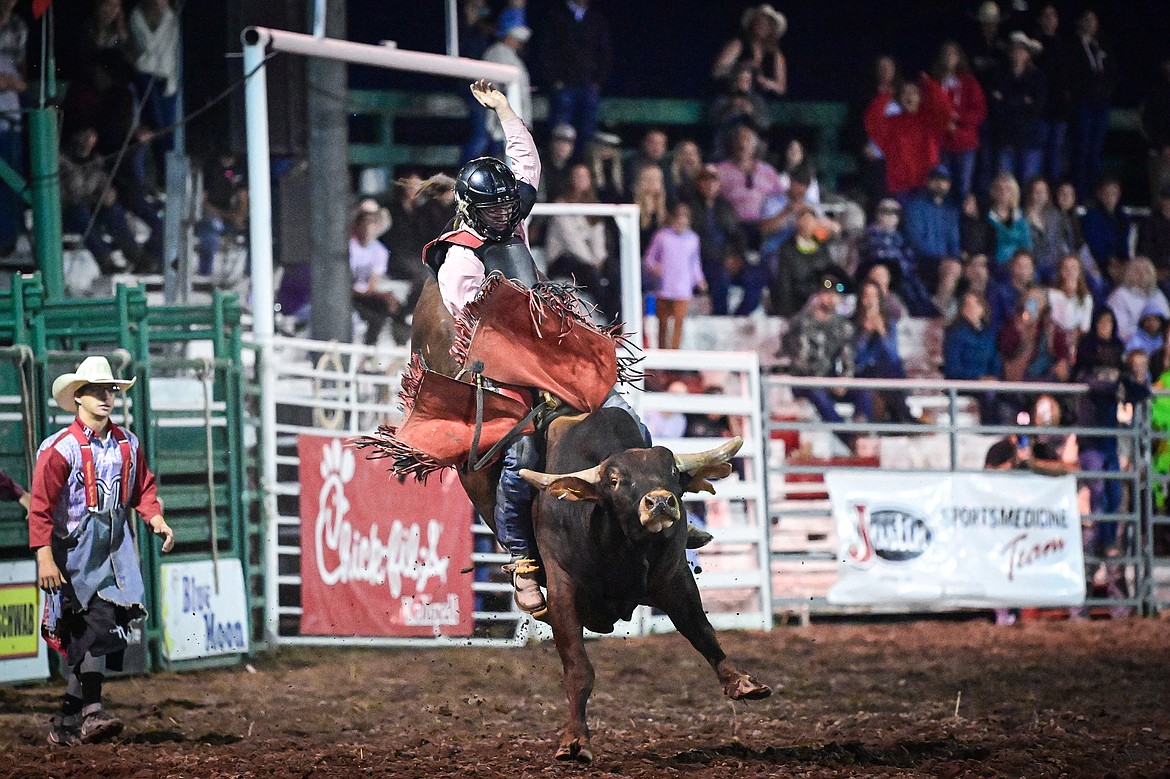 Korbin Baldwin, from Whitefish, competes in bull riding at the PRCA Rodeo during the Northwest Montana Fair & Rodeo on Friday, Aug. 16. (Casey Kreider/Daily Inter Lake)