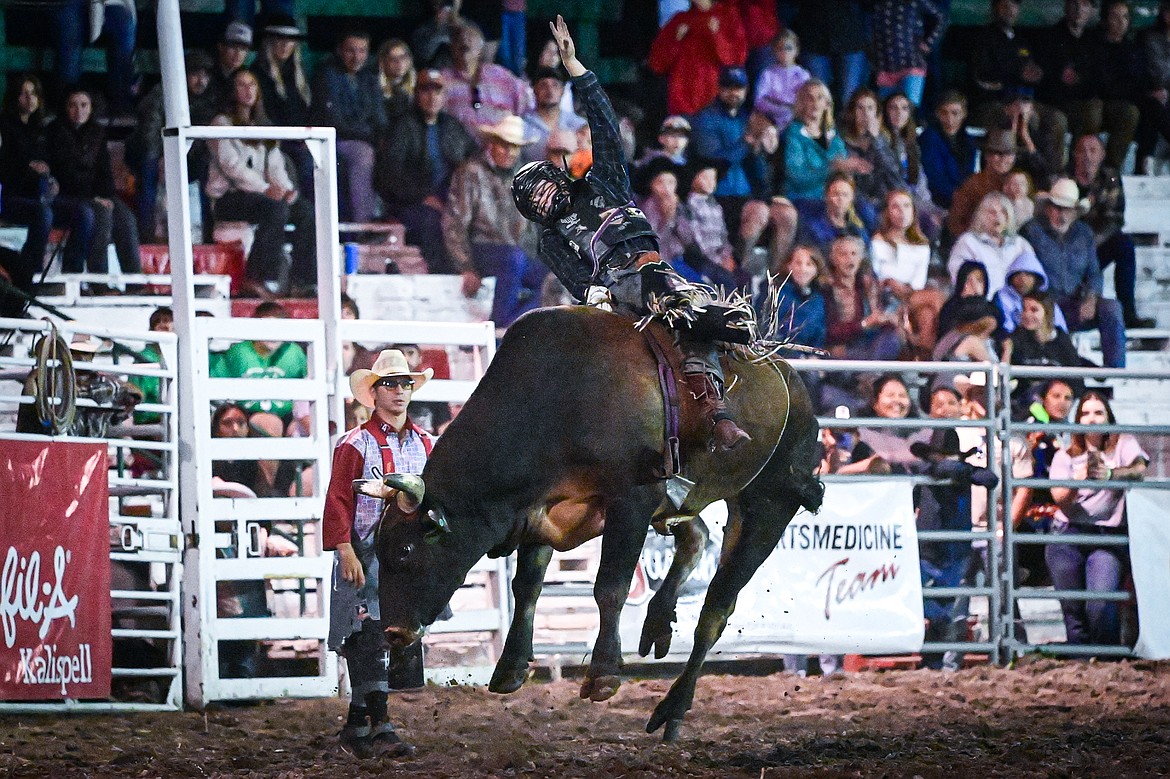 Octavius Christianson, from Columbia Falls, competes in bull riding at the PRCA Rodeo during the Northwest Montana Fair & Rodeo on Friday, Aug. 16. (Casey Kreider/Daily Inter Lake)