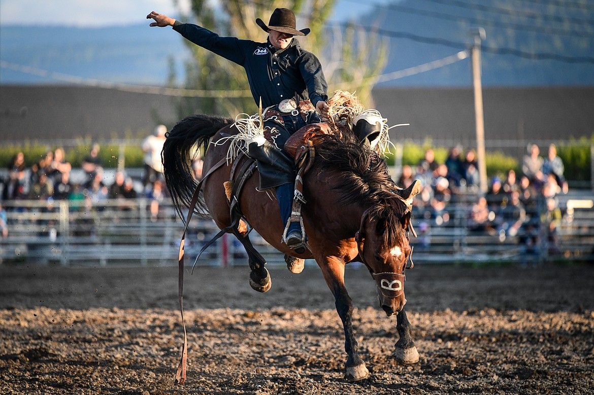 Ira Dickinson rides R Watsons Boom Baby during saddle bronc riding at the PRCA Rodeo during the Northwest Montana Fair & Rodeo on Friday, Aug. 16. (Casey Kreider/Daily Inter Lake)