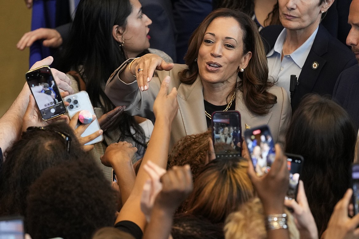 Democratic presidential nominee Vice President Kamala Harris greets attendees after speaking about the administration's efforts to lower prescription drug costs during an event at Prince George's Community College in Largo, Md., Thursday, Aug. 15, 2024. (AP Photo/Susan Walsh)