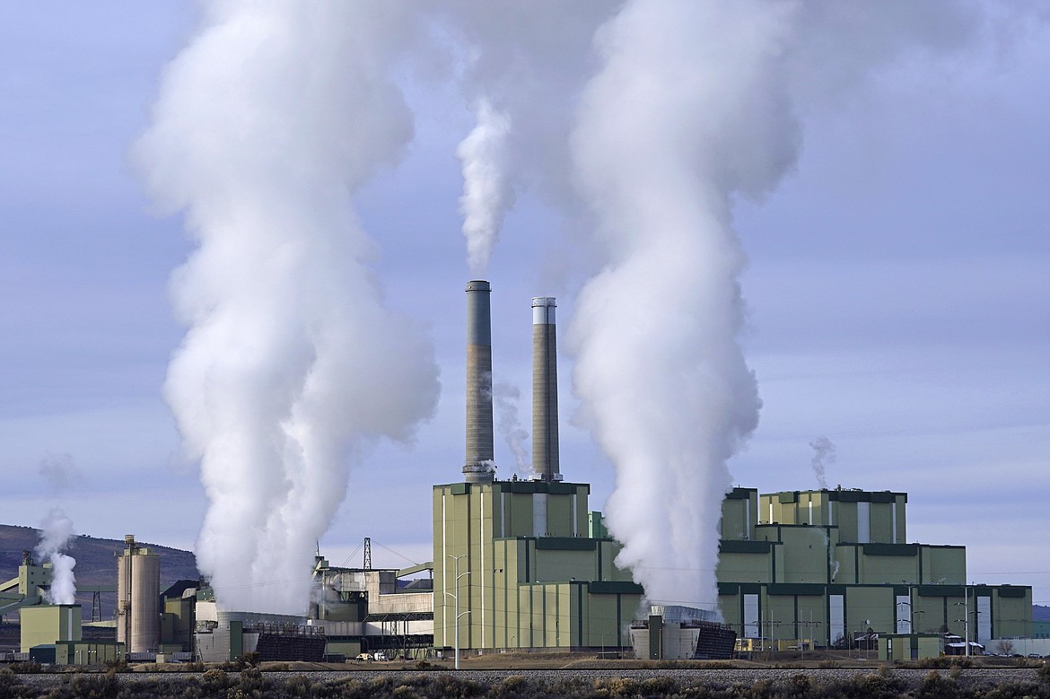 Steam billows from a coal-fired power plant Nov. 18, 2021, in Craig, Colo. A federal appeals court on Friday, July 19, 2024, allowed a Biden administration rule aimed at limiting planet-warming pollution from coal-fired power plants to remain in place, even as legal challenges continue. The EPA rule, announced in April, would force many coal-fired power plants to capture 90% of their carbon emissions or shut down within eight years. (AP Photo/Rick Bowmer, File)