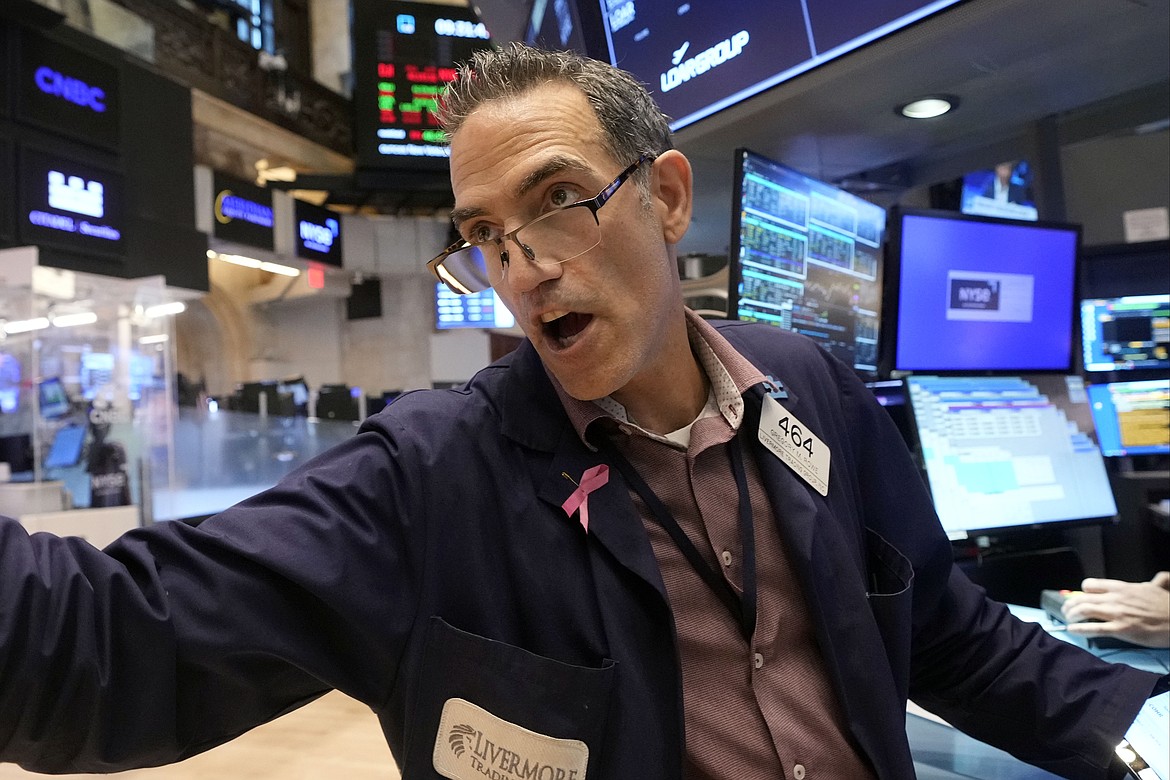 Trader Gregory Rowe works on the floor of the New York Stock Exchange, Friday, Aug. 16, 2024. (AP Photo/Richard Drew)