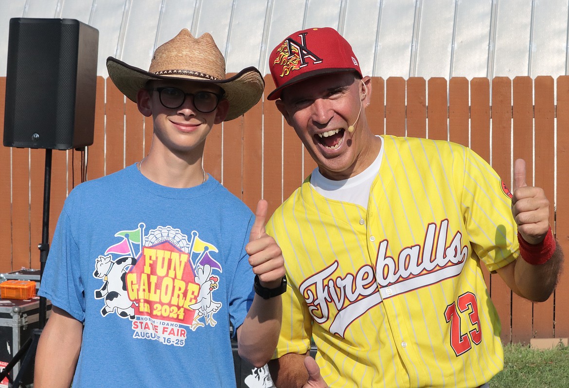 Christopher Perry of Athol joins "Paz" for a picture at the North Idaho State Fair on Friday.