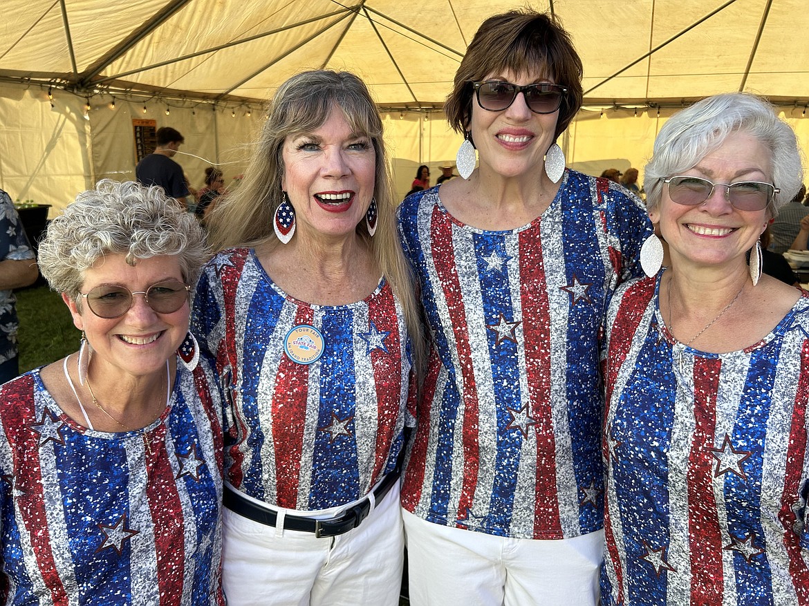 Erin Mueller, Melodi Hays, Debbie O’Brien and Glenda Kohoutek are all smiles after singing the national anthem to open the North Idaho State Fair.