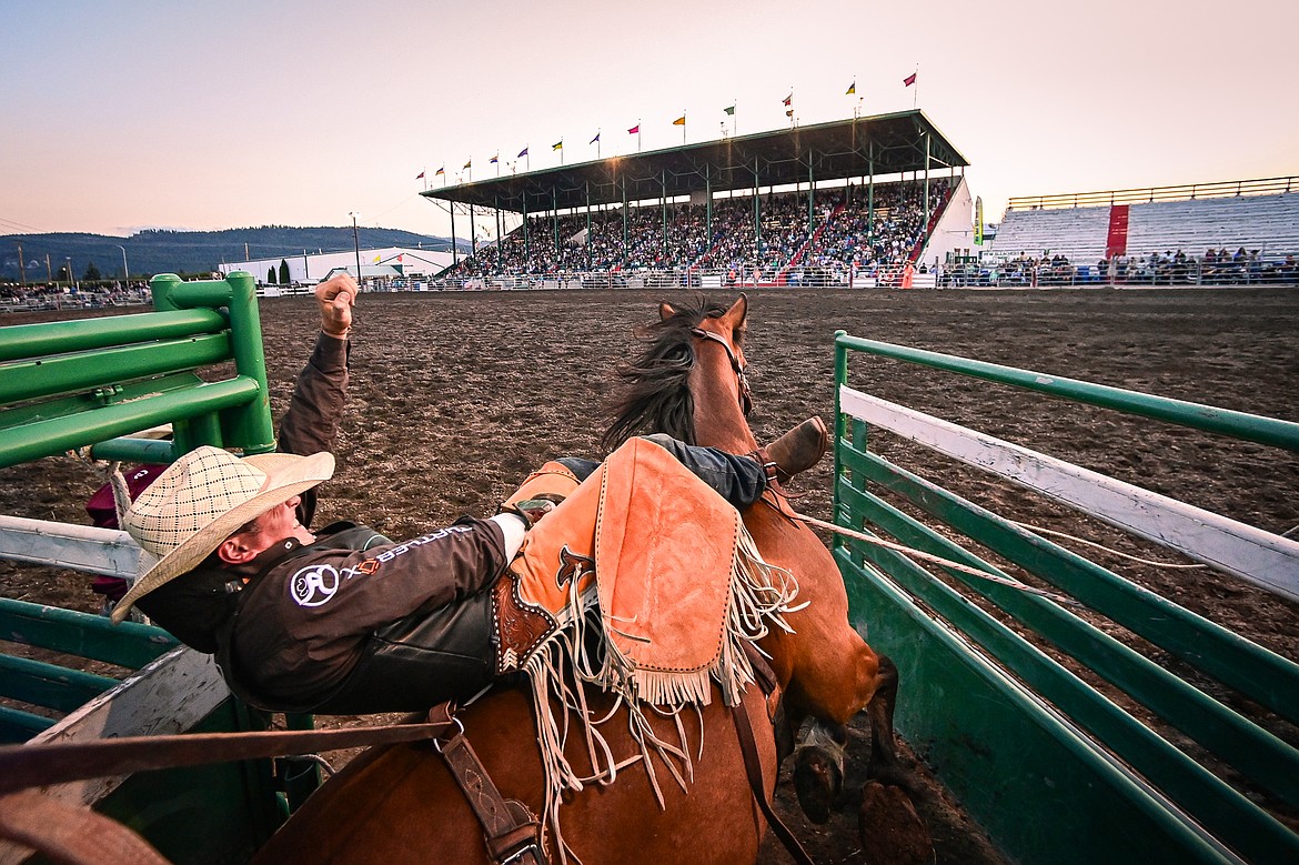 Jess Pope busts out of the chute on his horse Here I Am during bareback riding at the PRCA Rodeo during the Northwest Montana Fair & Rodeo on Friday, Aug. 16. (Casey Kreider/Daily Inter Lake)