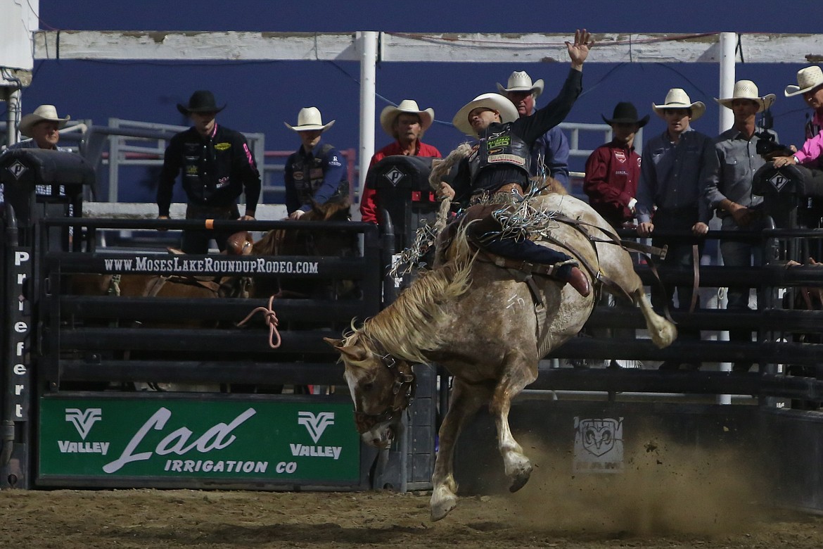 Isaac Diaz competes in the saddle bronc Thursday at the Moses Lake Roundup.